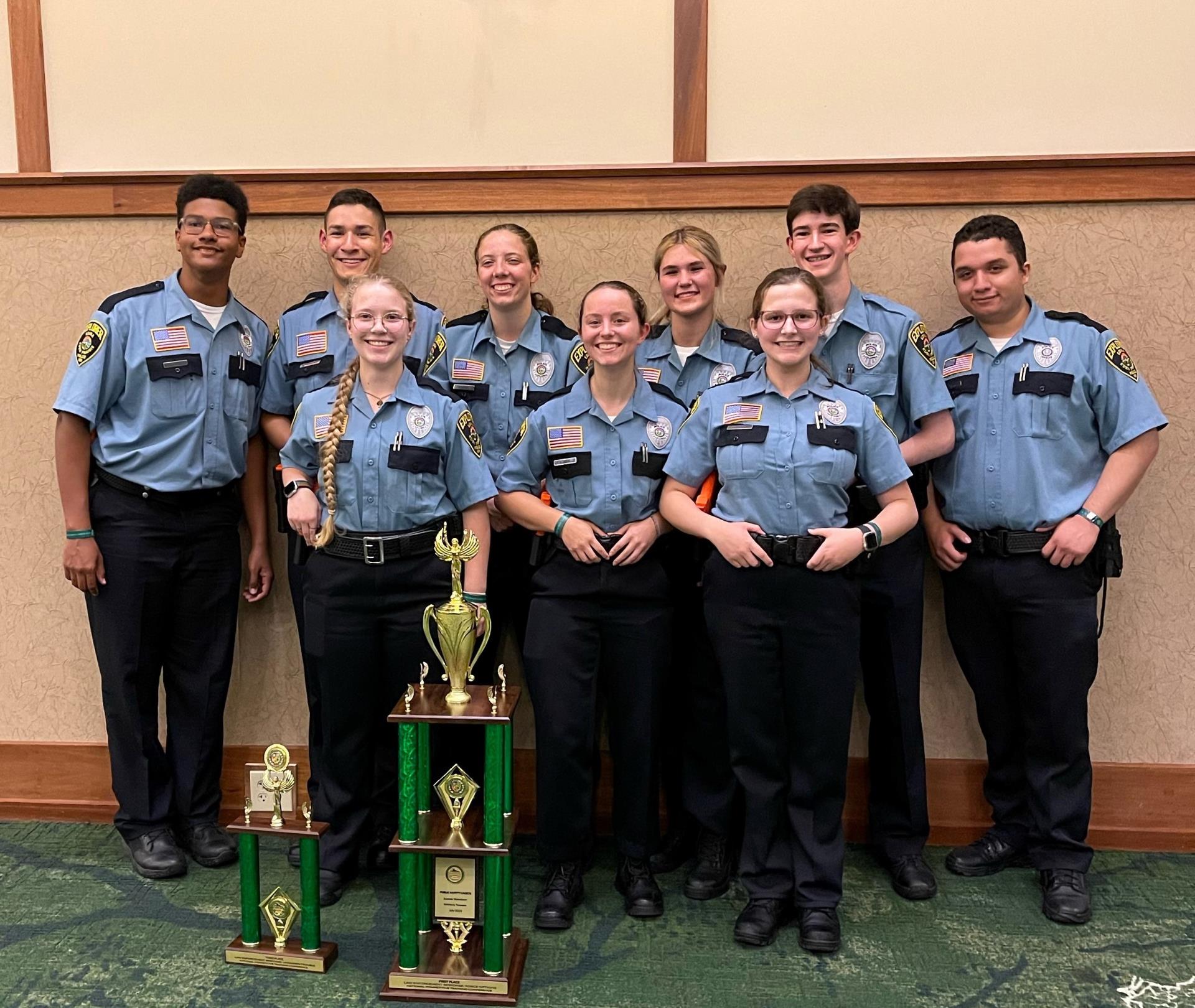 A group of Edina/Eden Prairie explorers pose with a trophy