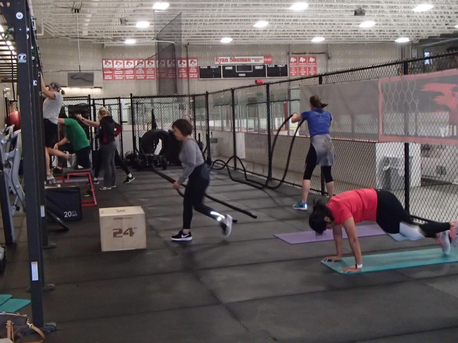 Group of people using The CAGE workout area